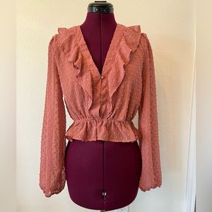 Cropped frilly pink blouse